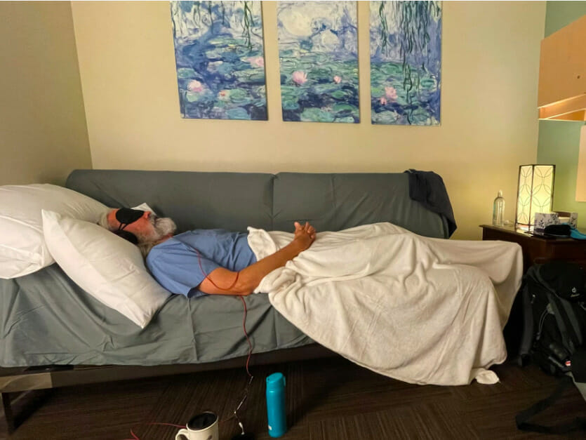 Person lying on a couch in a study suite